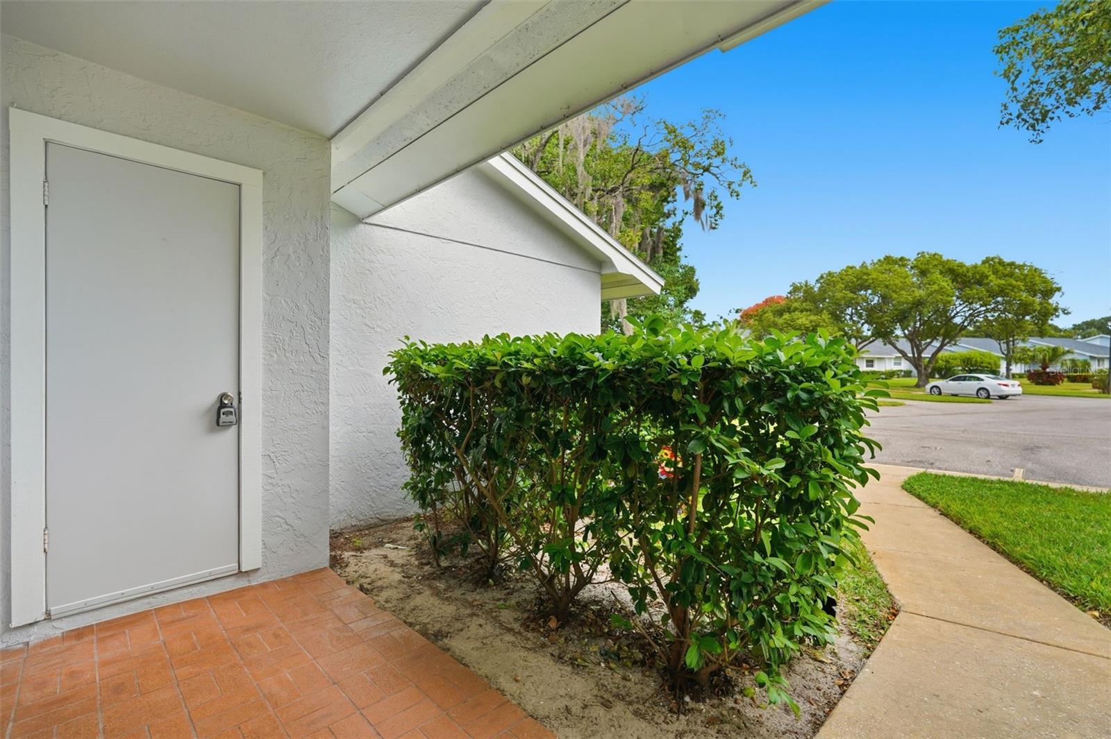 Front porch view of extra storage room