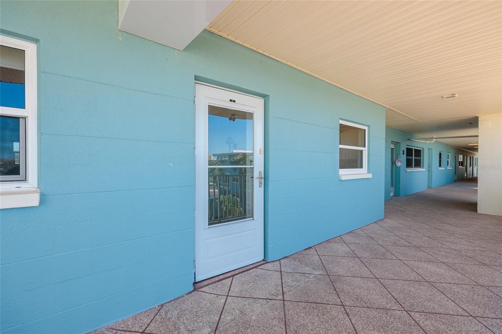 #55 & covered walkway/porch.