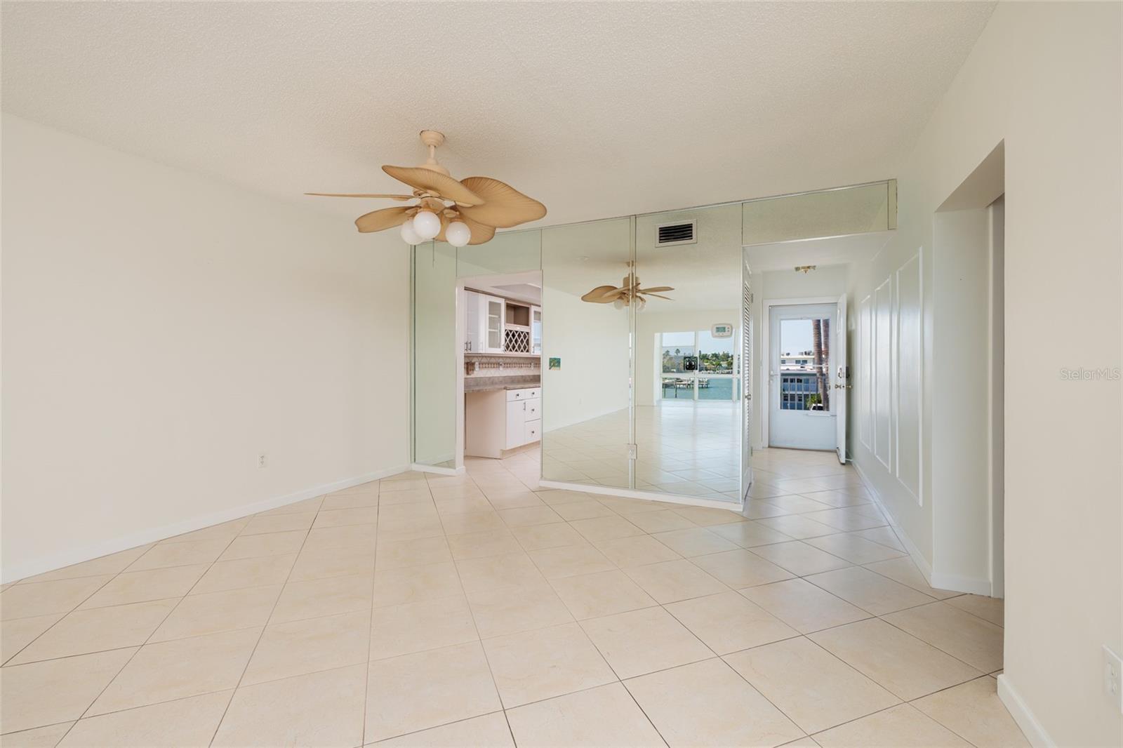 Dining area, Kitchen on left. 2nd bedroom & bathroom entrance on far right.