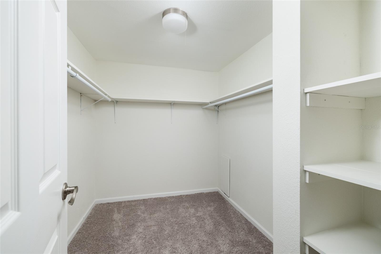 Primary bedroom walk-in closet.