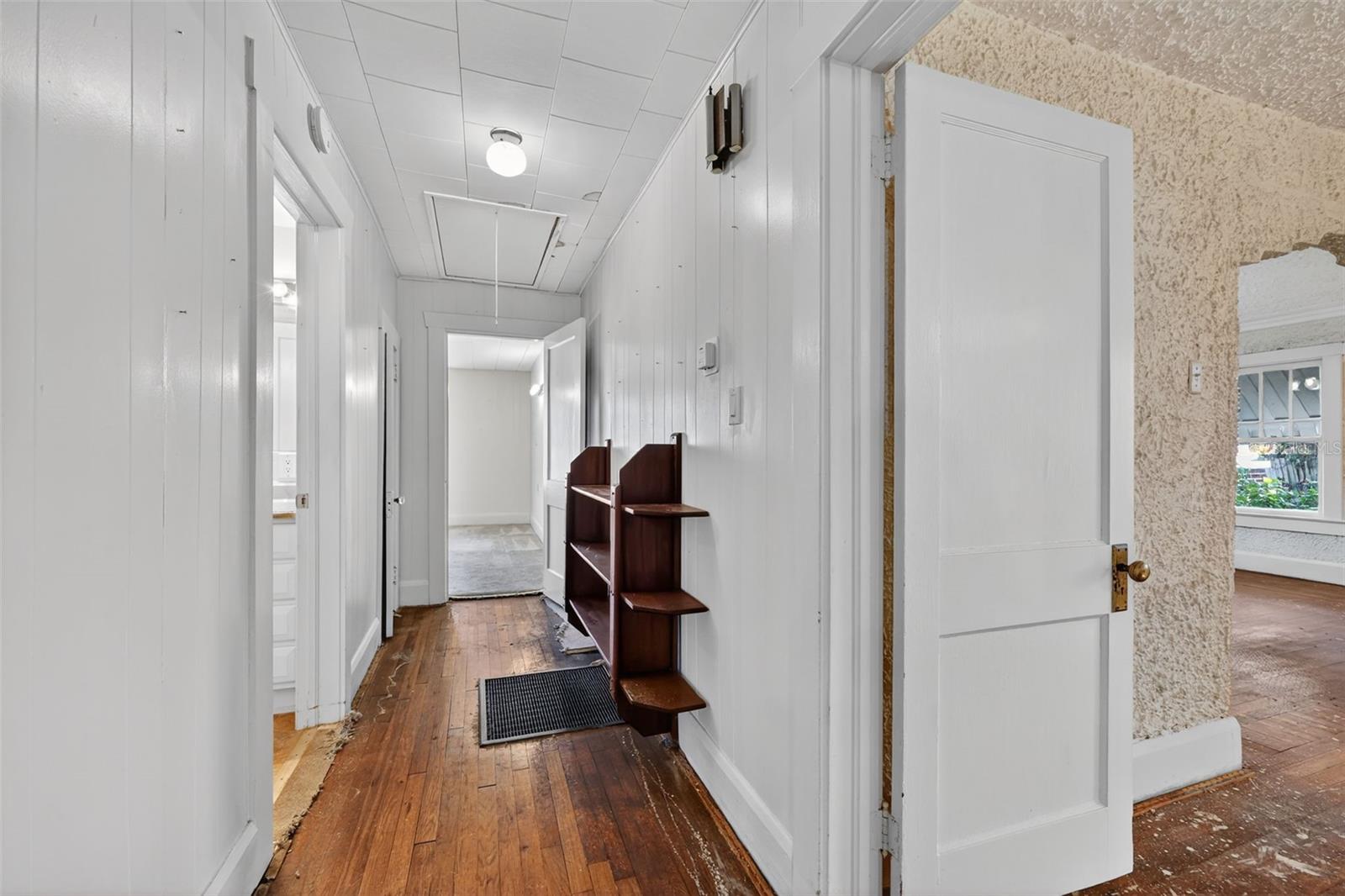 Carpet is partially removed in the hallway and these boards are a little wider than in living room and dining room.