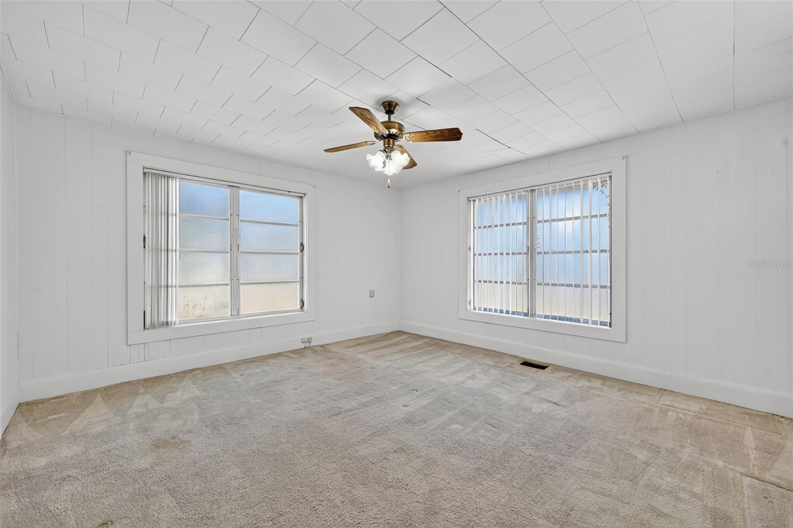 Front bedroom with 2 closets, and a cedar closet inside one of them.  Wood floors are yet to be revealed.  Would you like to come pull up a corner for a peak?
