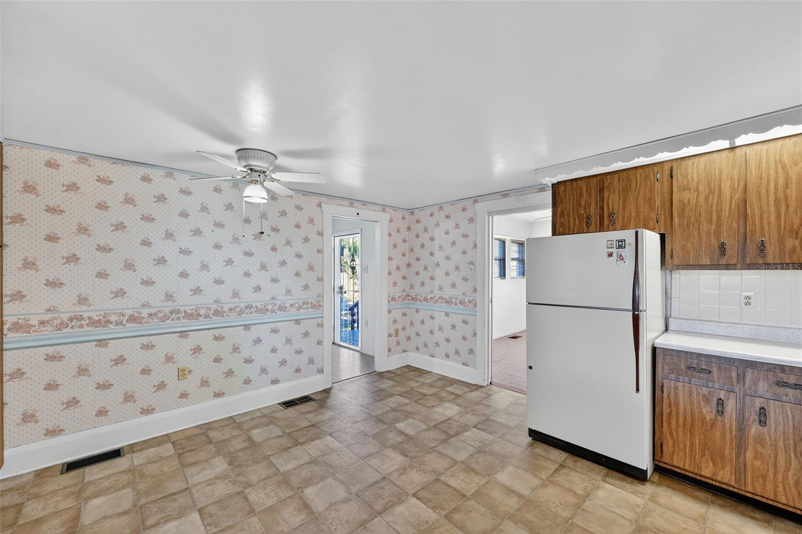 The rear door goes through the large laundry room and out to the rear porch that has been freshly painted