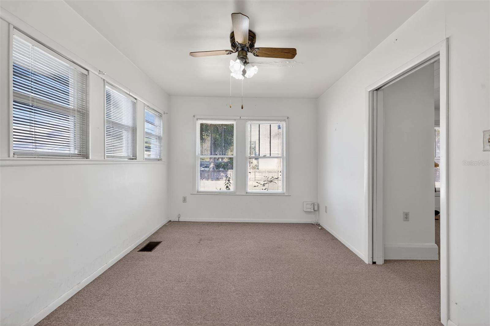 Counting as a 3rd bedroom and would need an armoire.  Could also be used as an office or flex room, with a pocket door to the middle bedroom