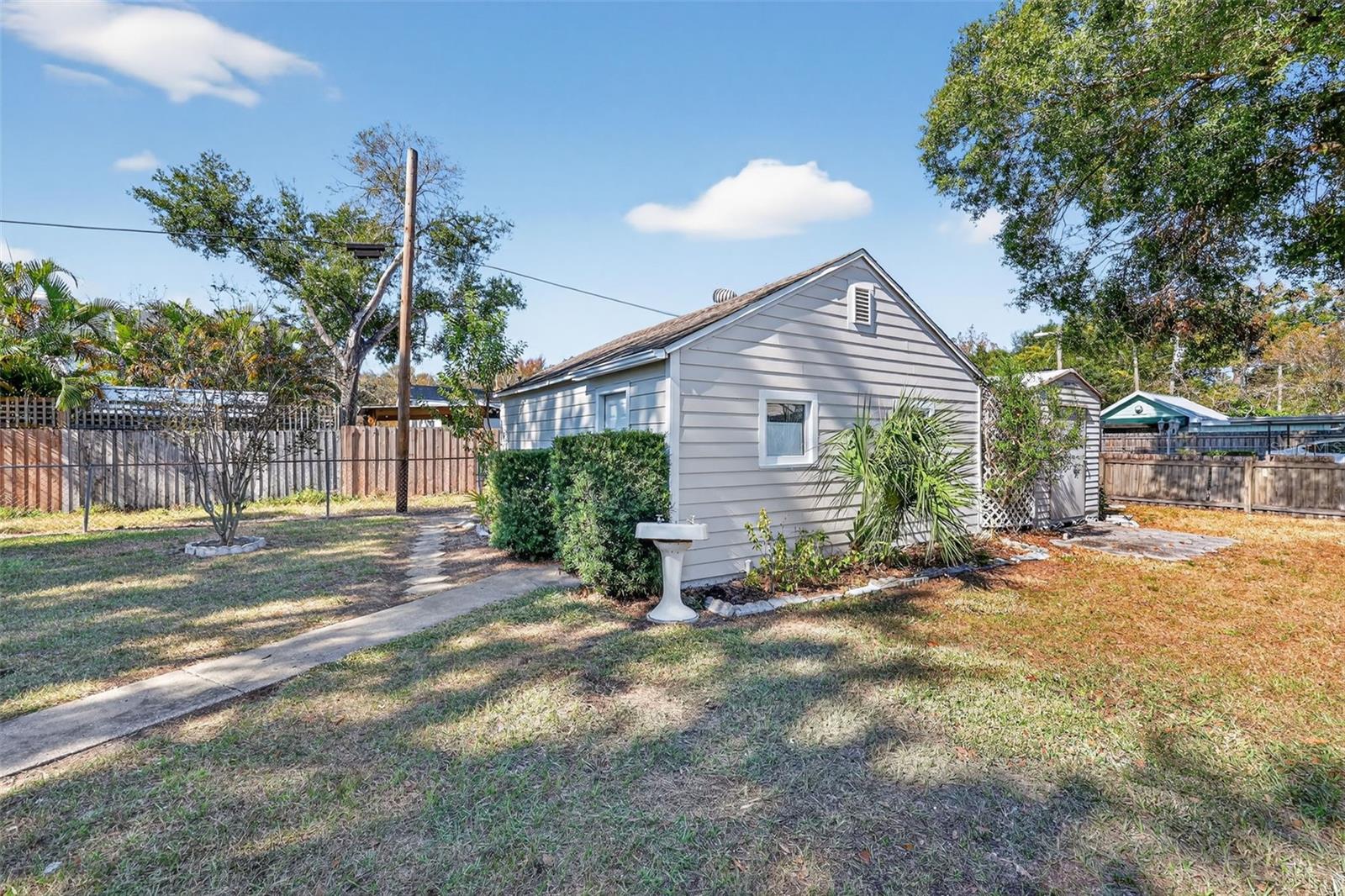 Detached garage and shed are on the north lot