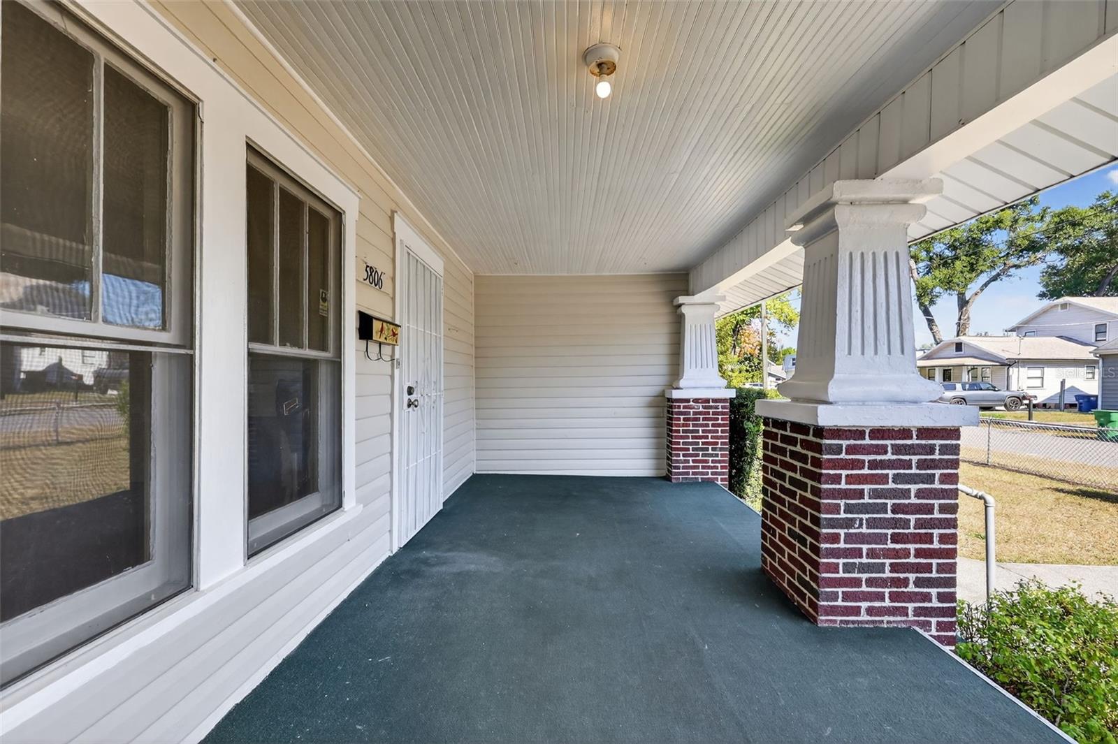 Your new porch swing fits nicely at the end of the front porch