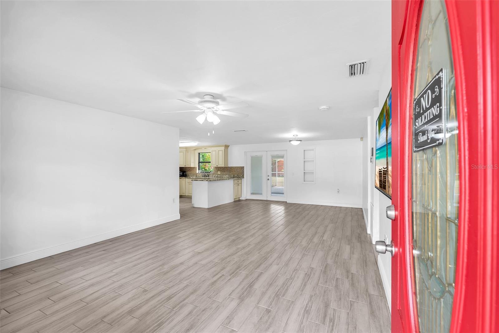 Step inside to find an inviting open-concept great room with durable ceramic tile flooring with wood grained look throughout.