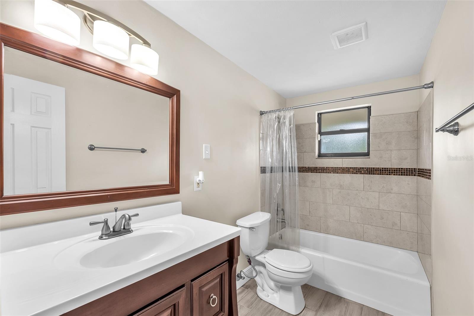Guest bathroom with tub/shower combination