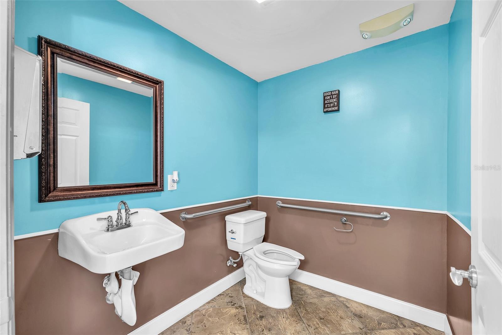 Completely furnished, professionally built ADA-compliant salon business suite with private entrance, additional AC unit, and hurricane impact-resistant entry and window, ideal for rental income or personal business.