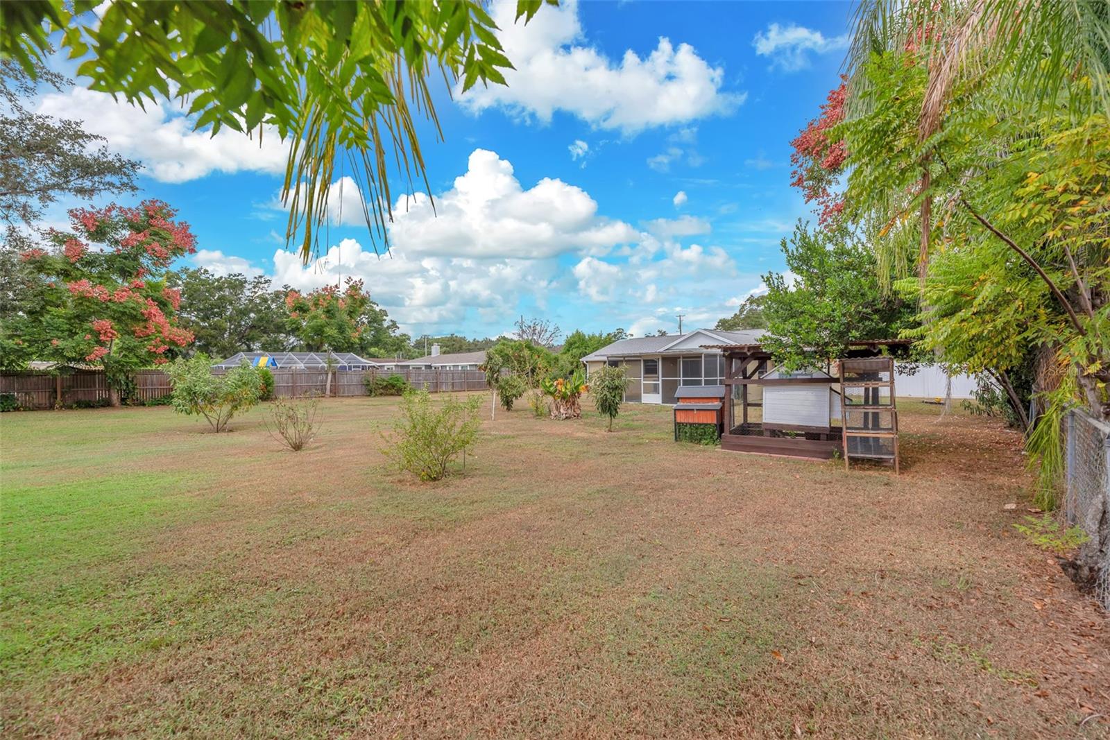Buyers will also love the charming enclosed chicken coop, perfect for gathering fresh eggs each morning