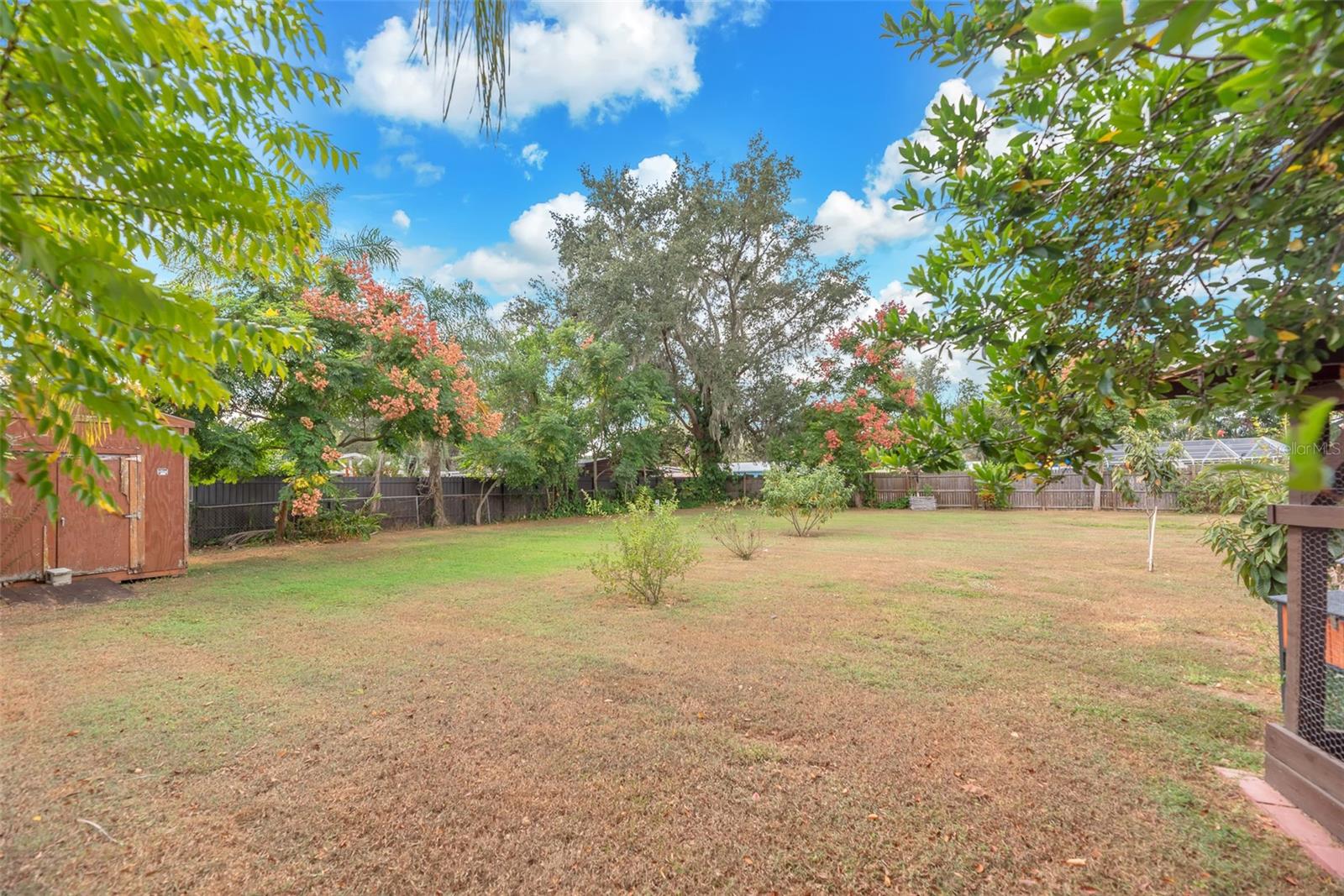 There is a spacious storage shed for tools, lawn equipment, or weekend projects.