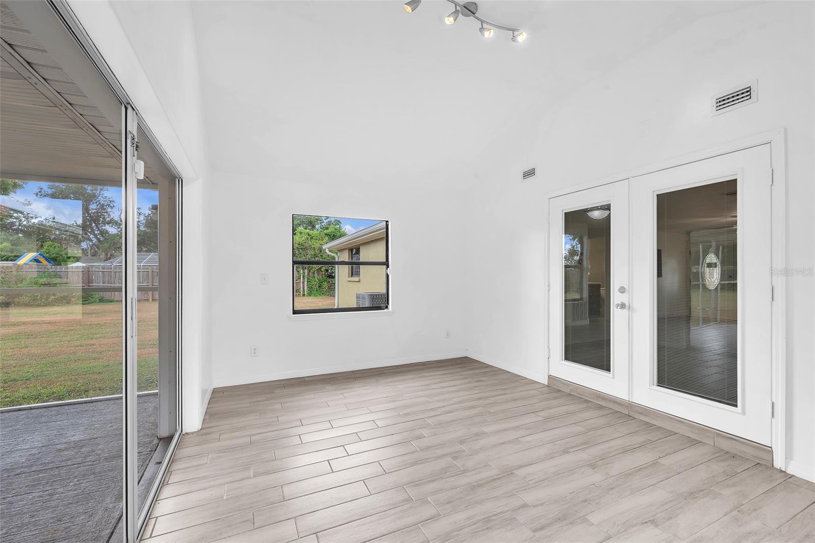 This versatile flex space can be used in a multitude of ways perfect for a home office, gym, playroom, studio, or additional family room.