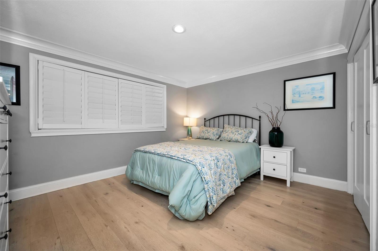 Guest bedroom with plantation shutters