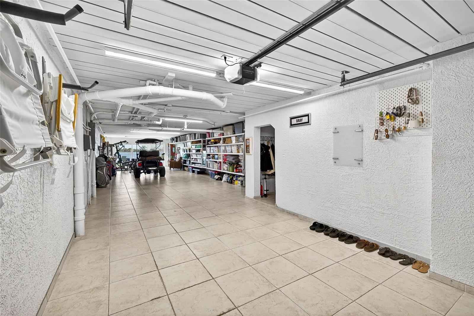 Tandem 3 car garage!! Attached shelves and nook for more storage