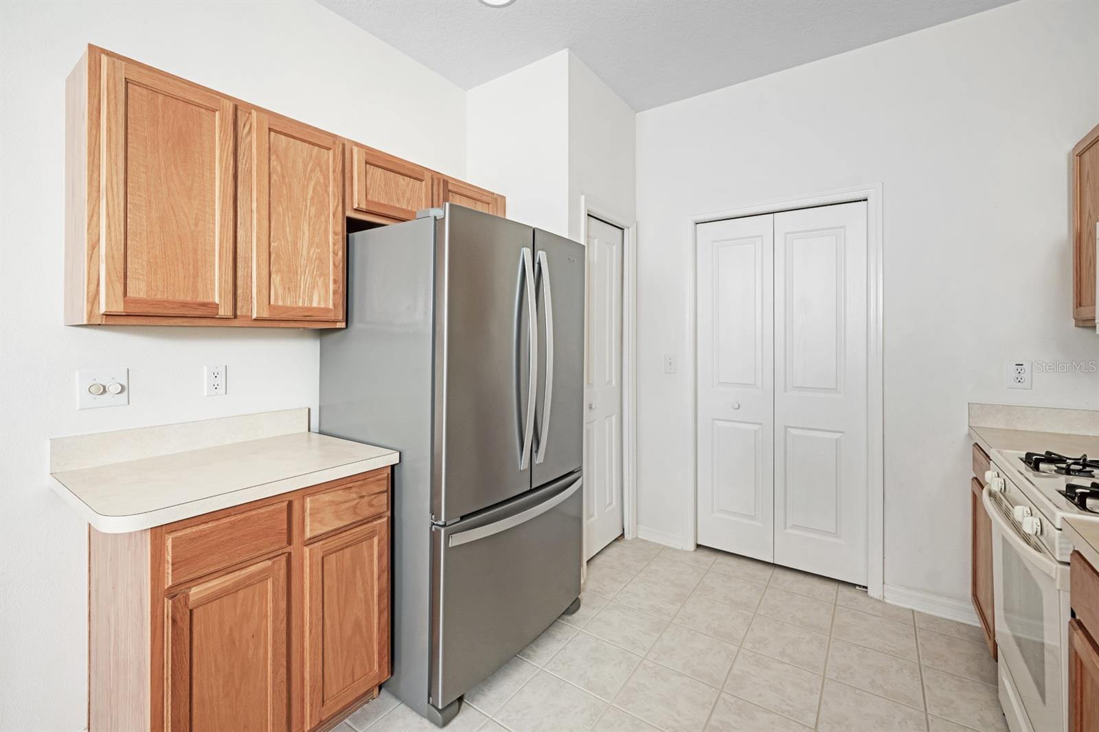KITCHEN VIEW #2, SIDE DOOR PANTRY, FACING DOOR IS LAUNDRY CLOSET