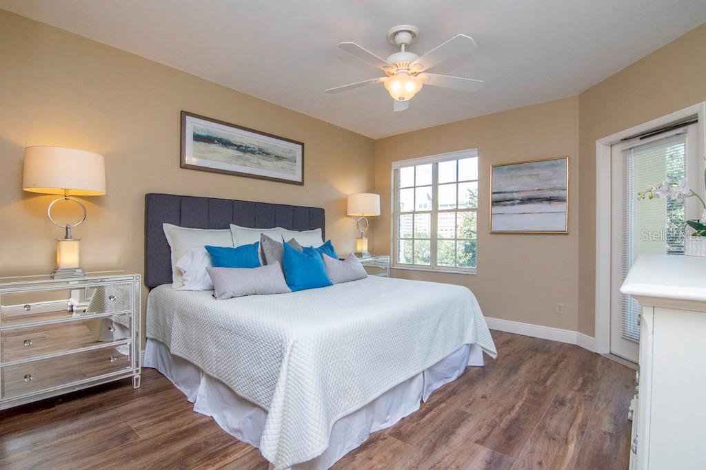 This thoughtfully updated third-floor residence features a smart split-bedroom layout with a generously scaled primary suite and a fully remodeled walk-in shower, a second bedroom positioned across the unit with direct access to a beautifully appointed guest bathroom, and a versatile third bedroom currently configured as a den/study with a tranquil courtyard