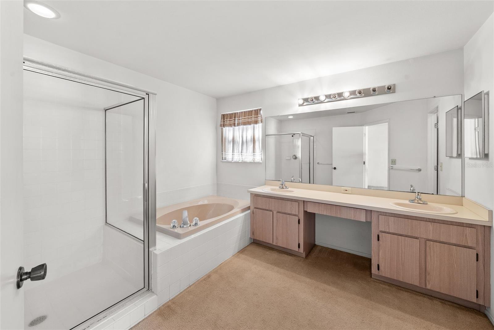 Large master bath with garden tub and walk-in shower and DUAL SINKS - plus priv. lavatory!