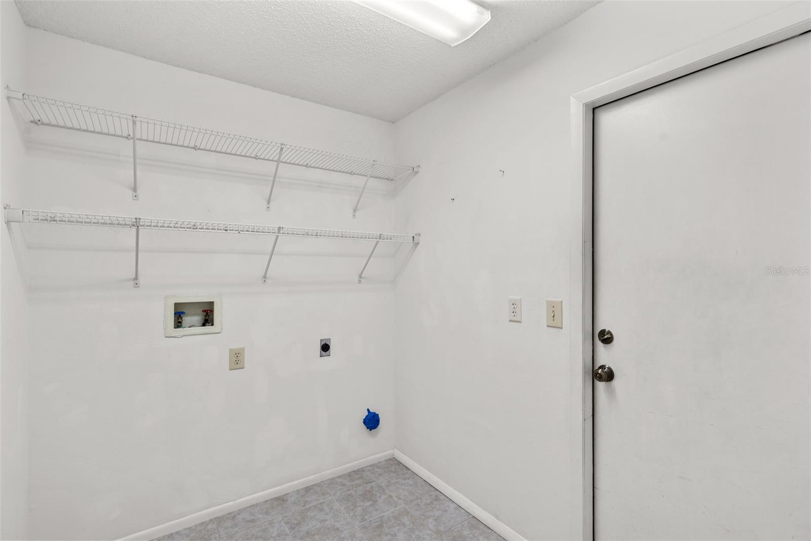 Inside/downstairs Laundry room off garage