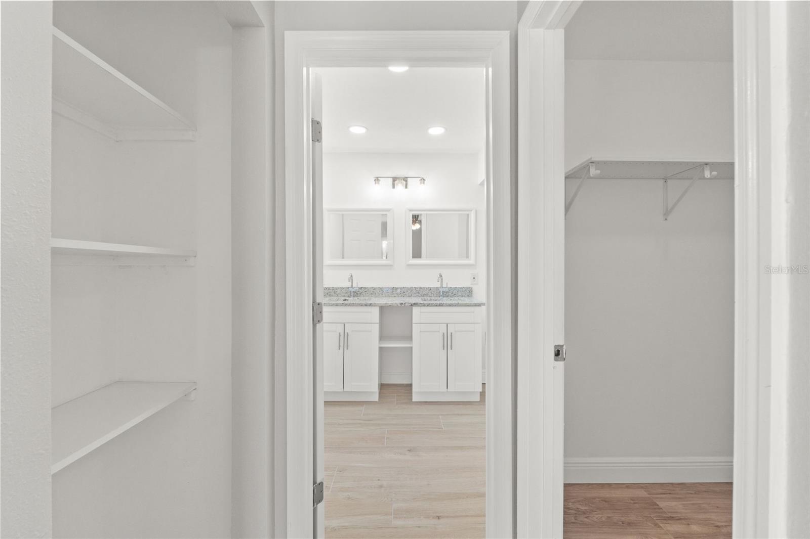 linen storage and walk-in closet