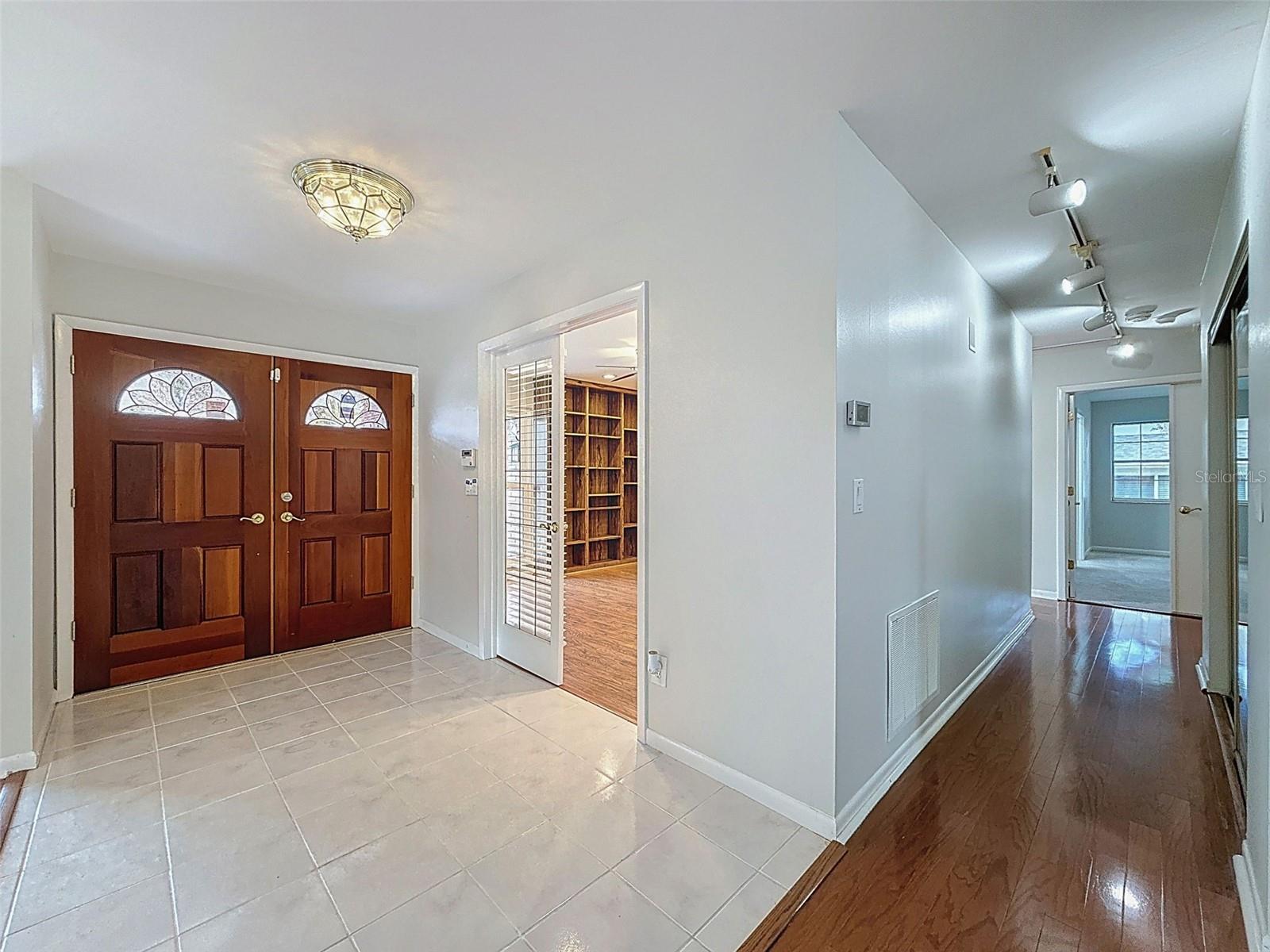 Front door/ Bedroom to the right