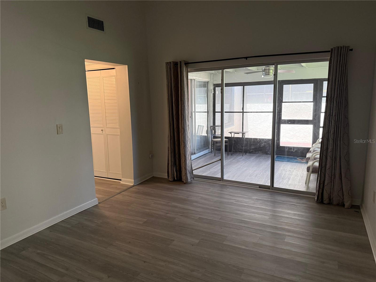 Large Primary bedroom with a full wall of sliding doors to the Florida room, opening outside to a large patio!