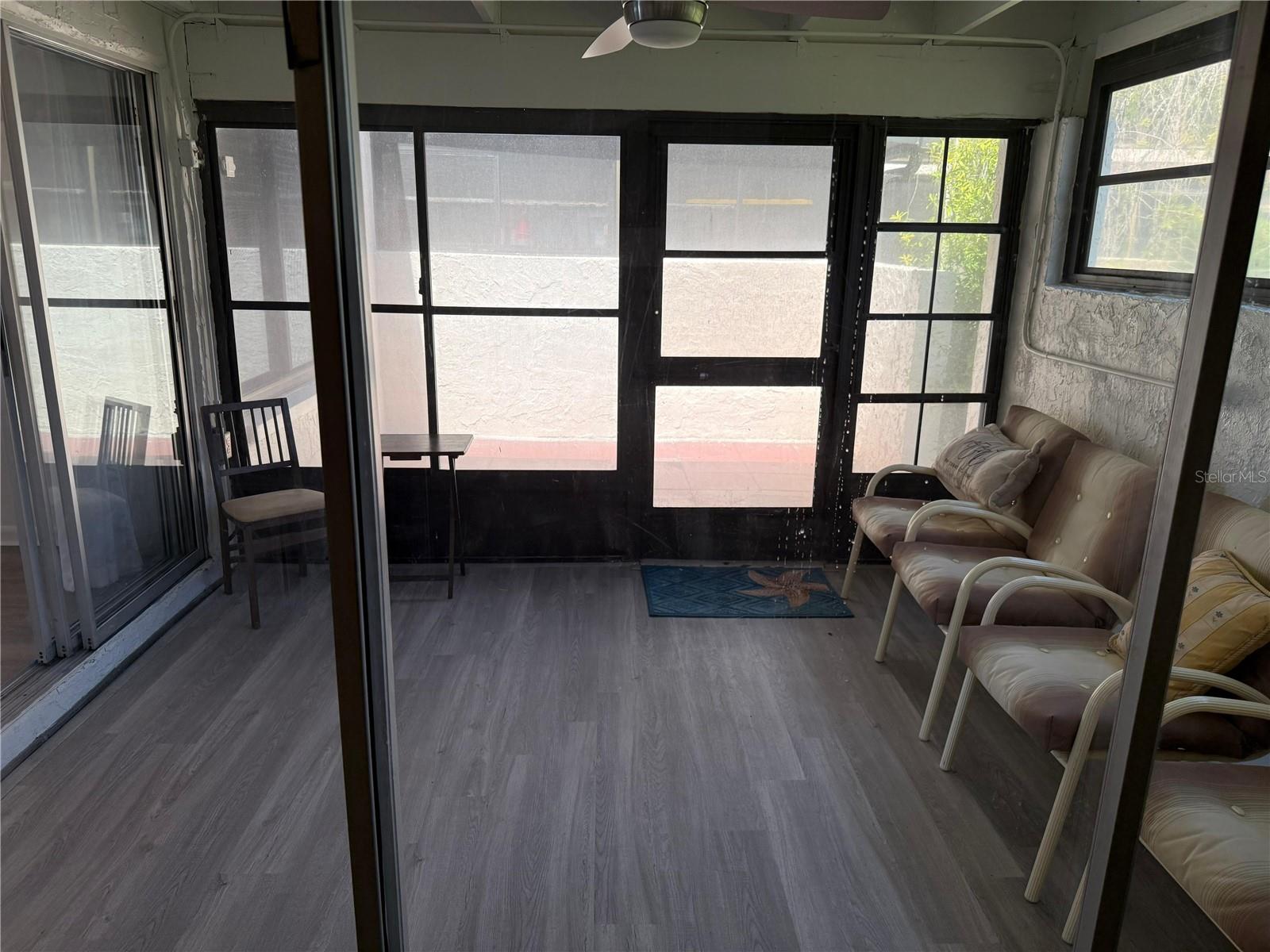 View from the primary bedroom to the Florida room opening to the Patio.