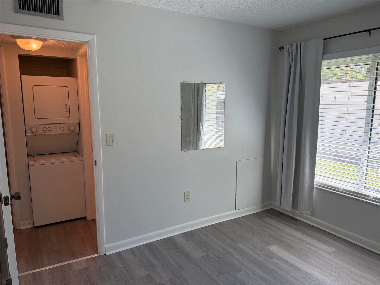 2nd bedroom with the guest bath just around the corner to the right.  Good Location for the washer and dryer.
