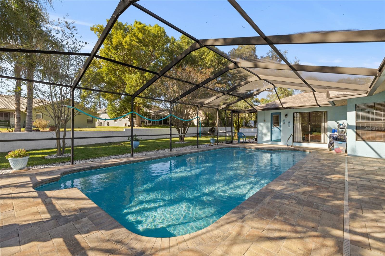 Screened pool with pavers