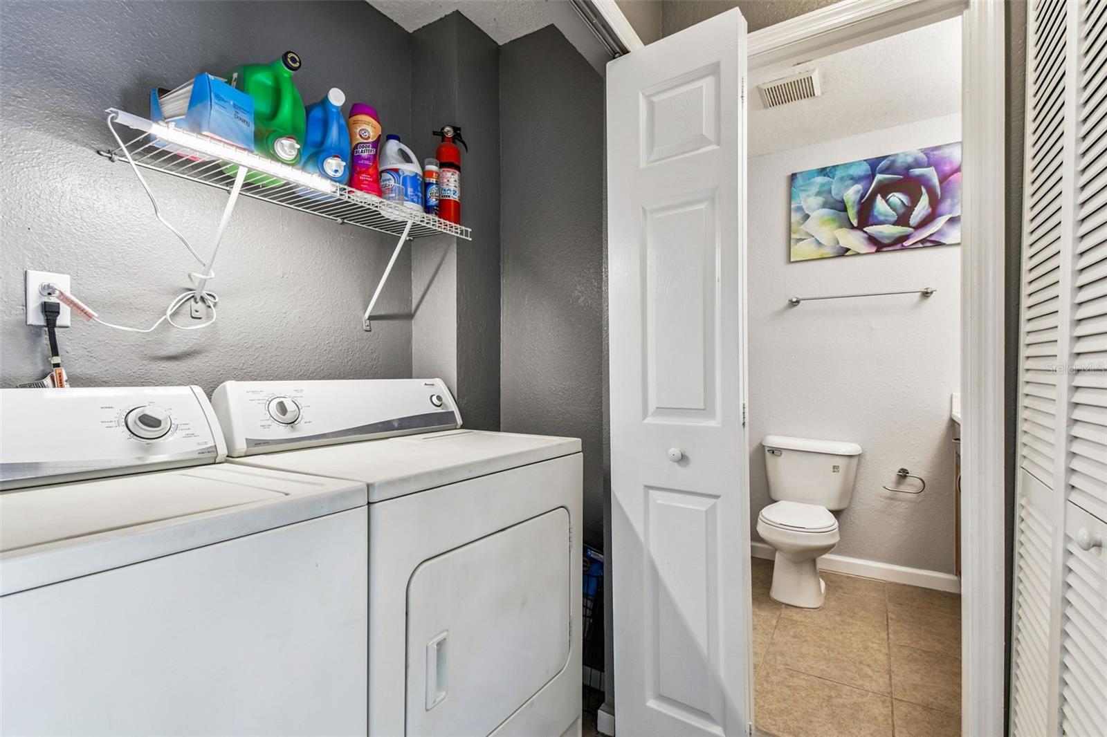 Laundry closet in hallway.