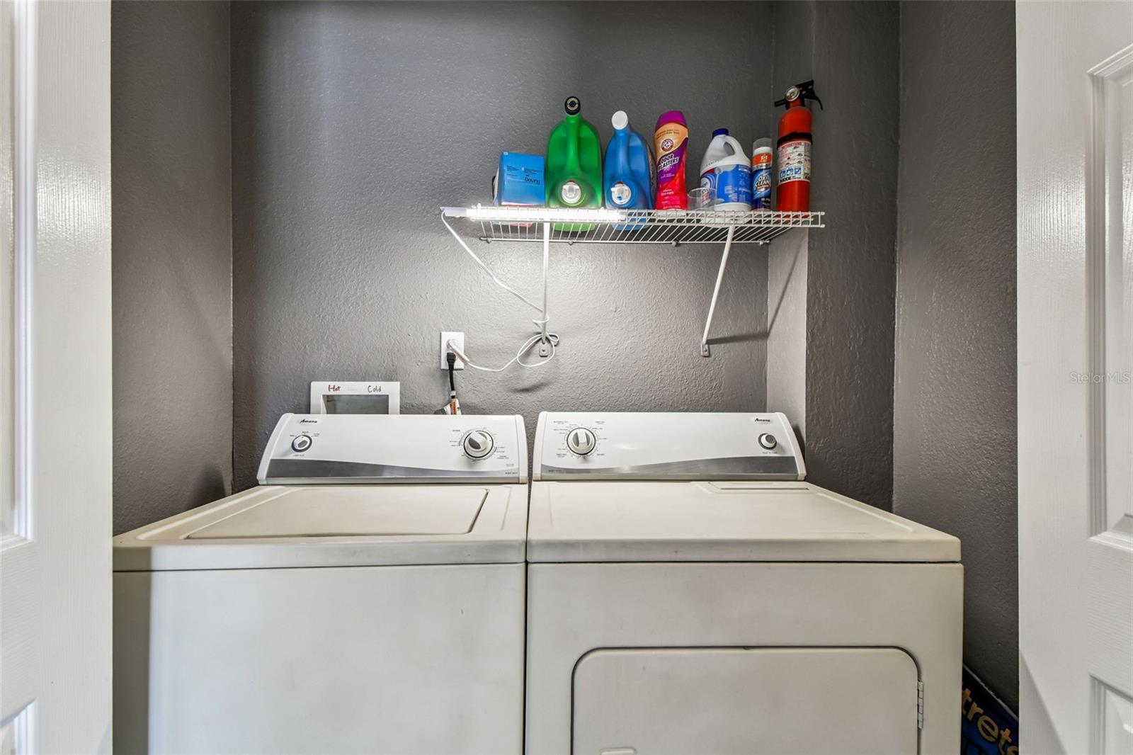 Laundry closet in hallway.