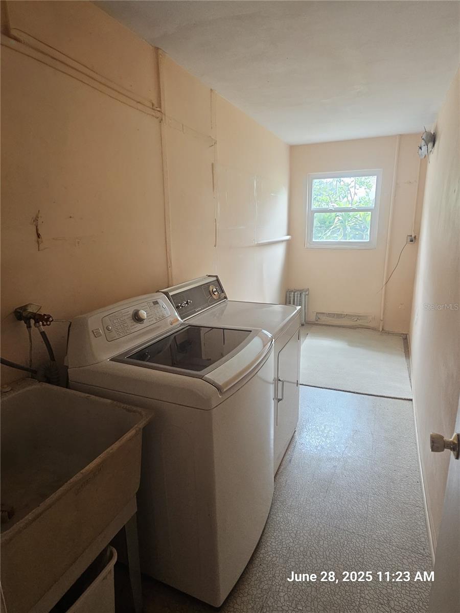 Large inside Utility Room- great for affitional cabinets for storage!