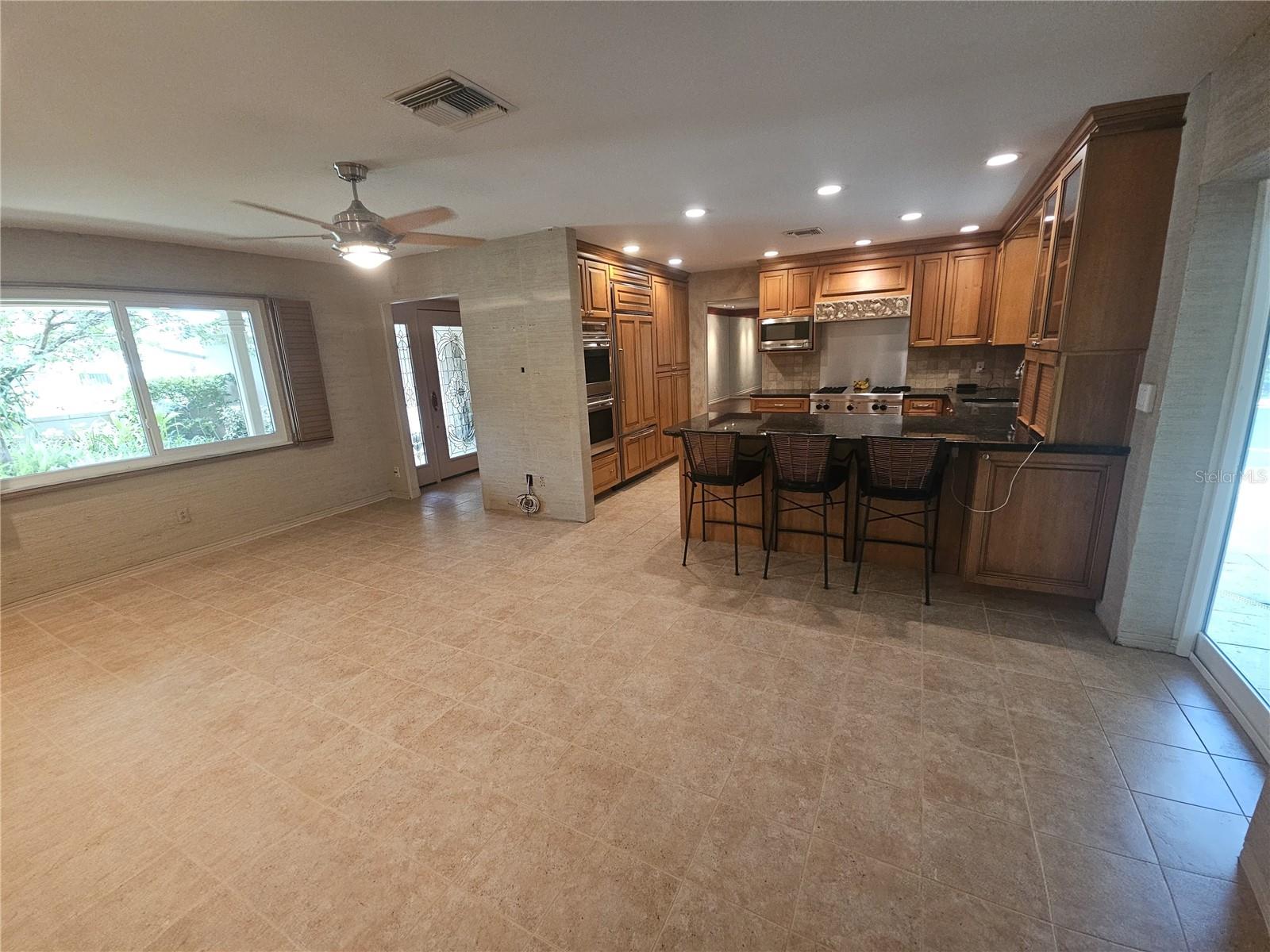 View of the family room to updated kitchen.