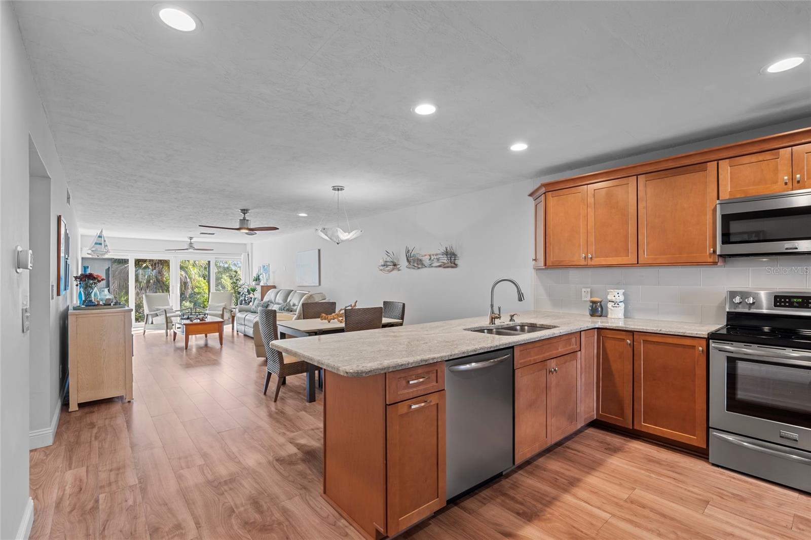 Open floor plan to kitchen, dining and living room