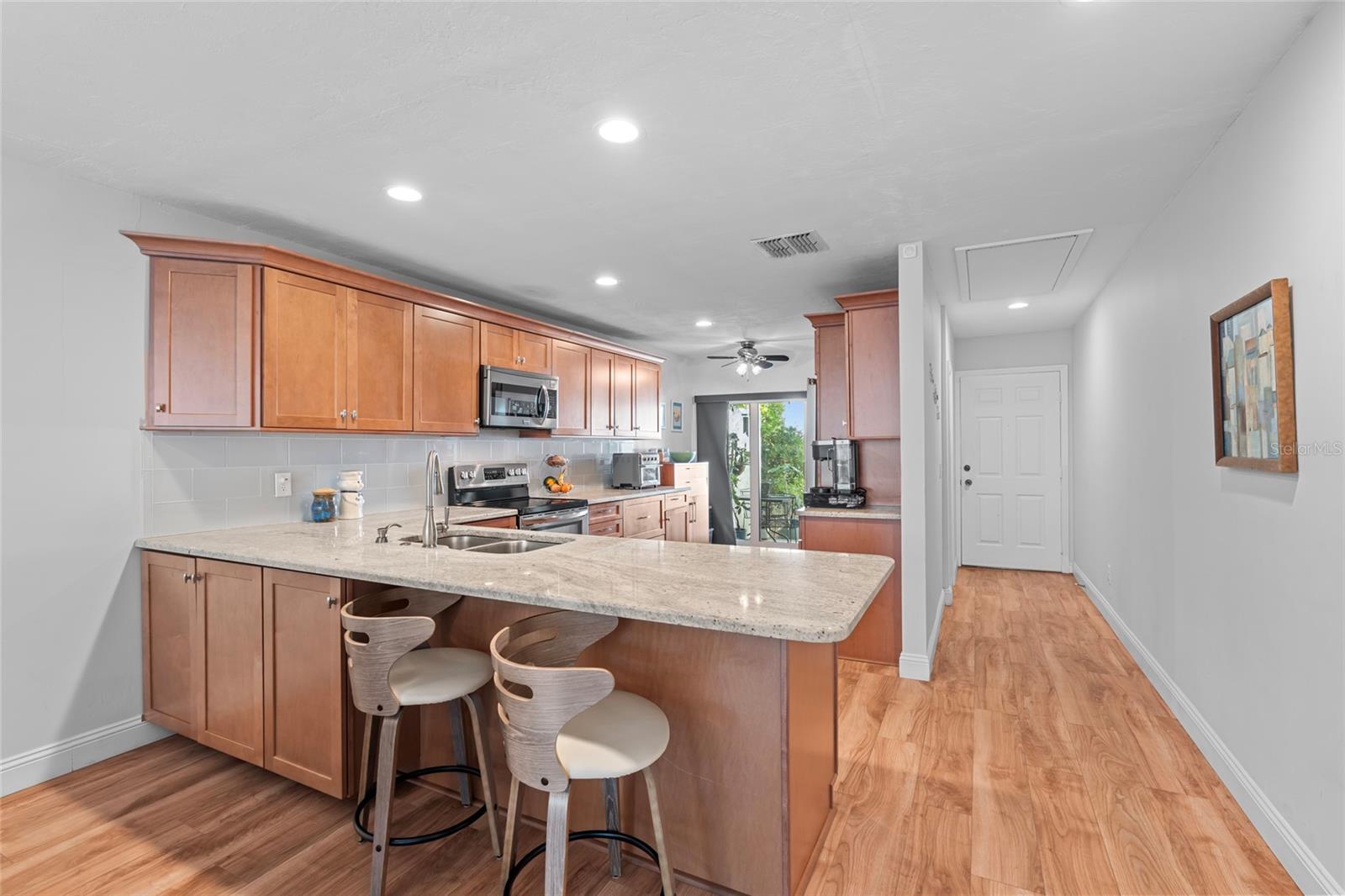 Updated Kitchen with granite countertops and breakfast bar