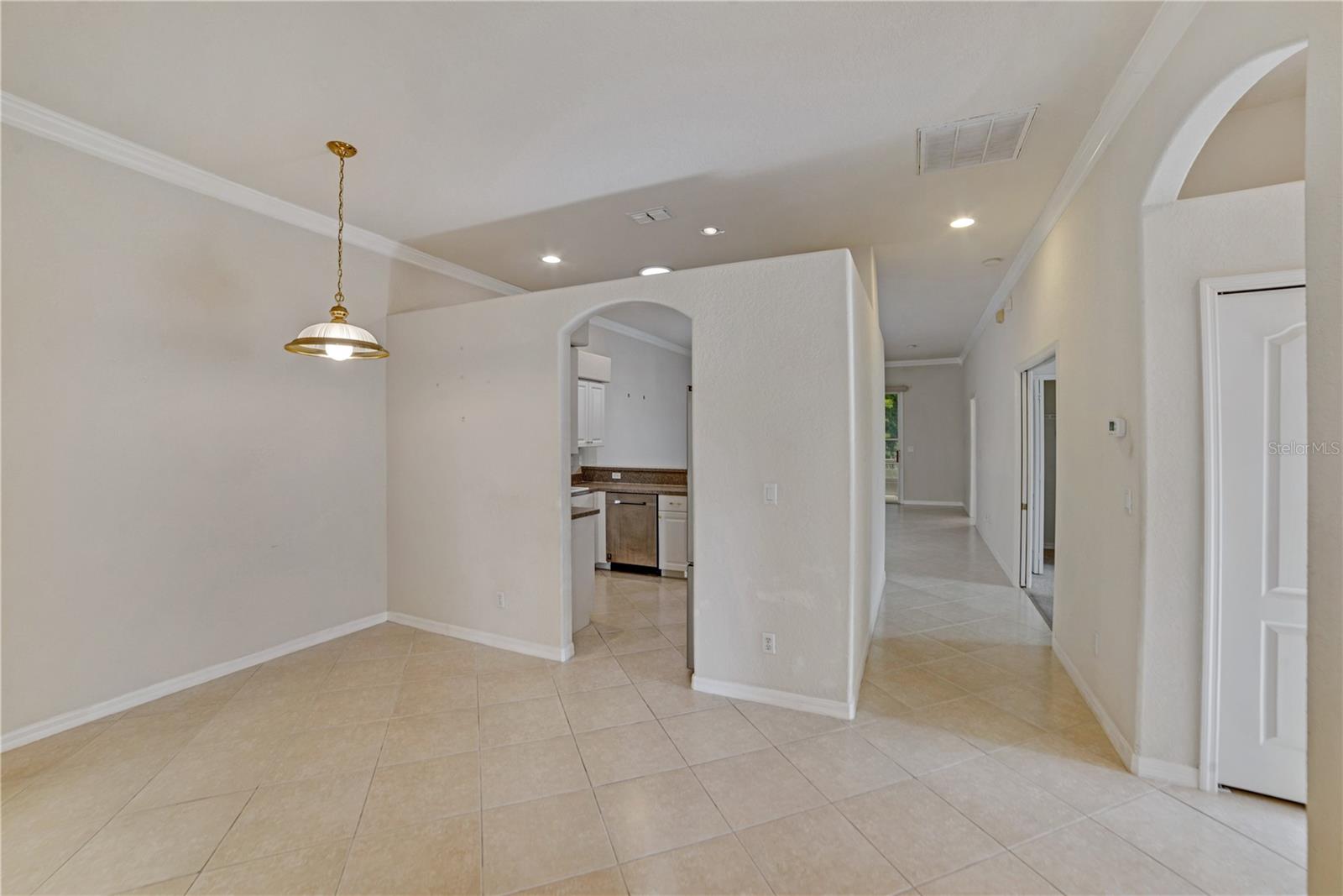 ENTER THROUGH FOYER TO DINING/FLEX ROOM ON RIGHT AND DEN AND GUEST ROOM AND BATH ON LEFT