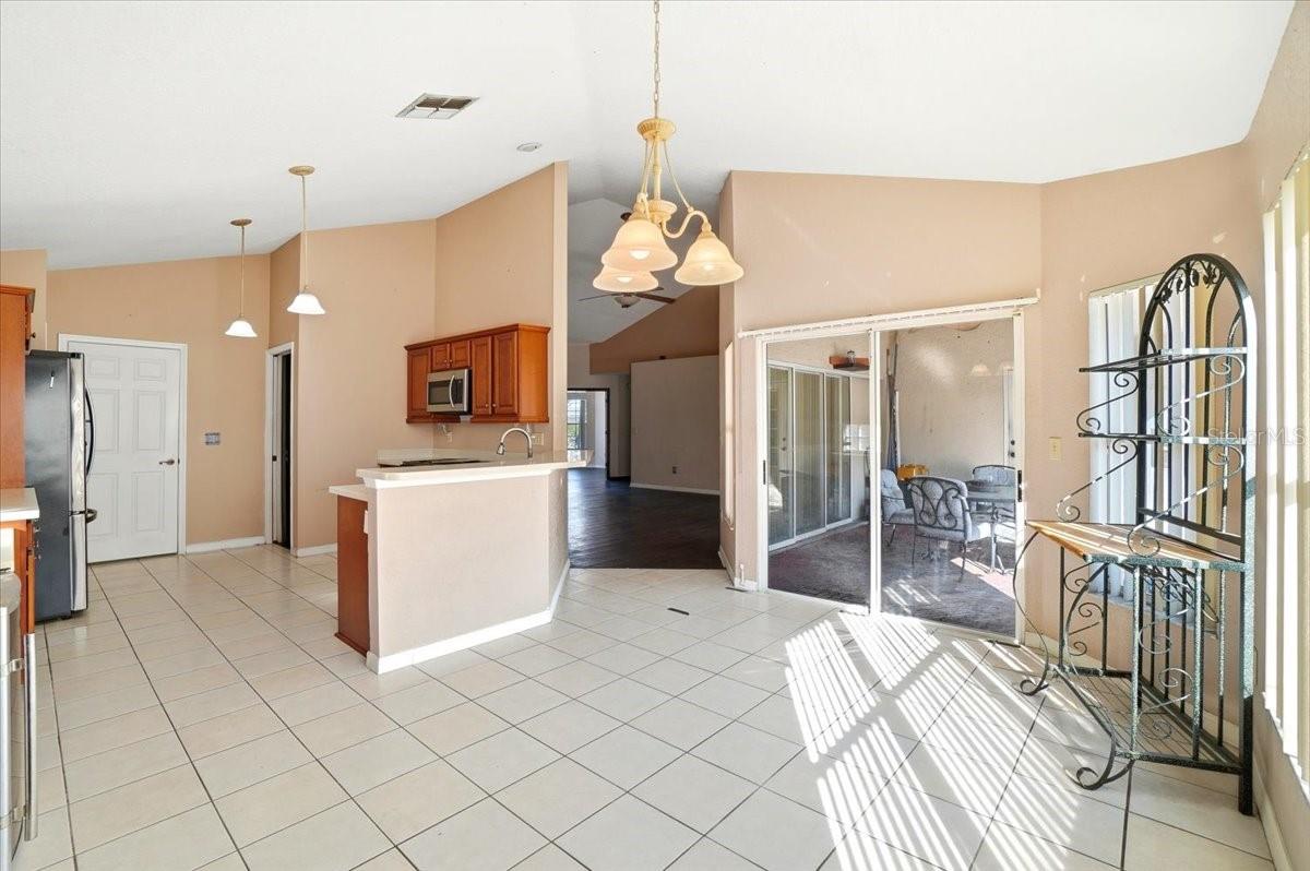 Kitchen and dining area with sliding door to pool