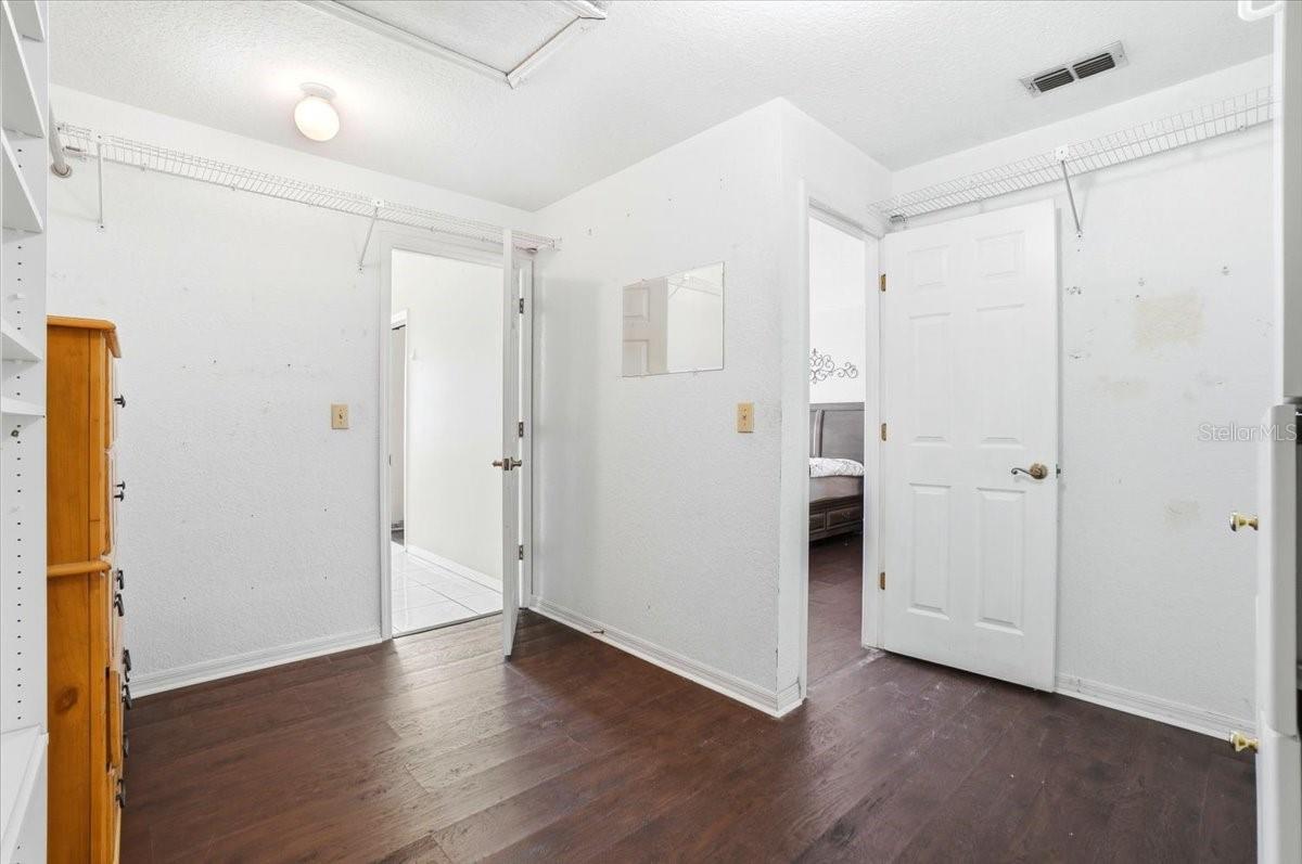 Primary LARGE walk-in closet with double entry