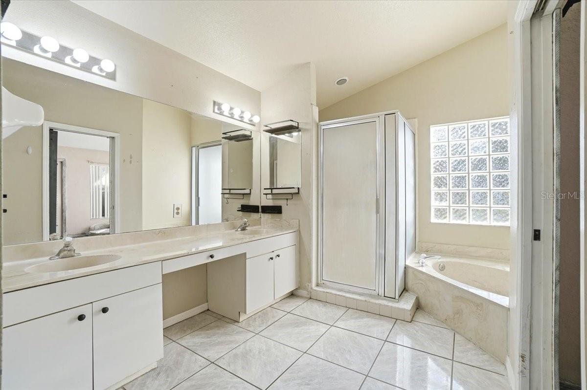 Primary bathroom with separate shower stall and garden tub