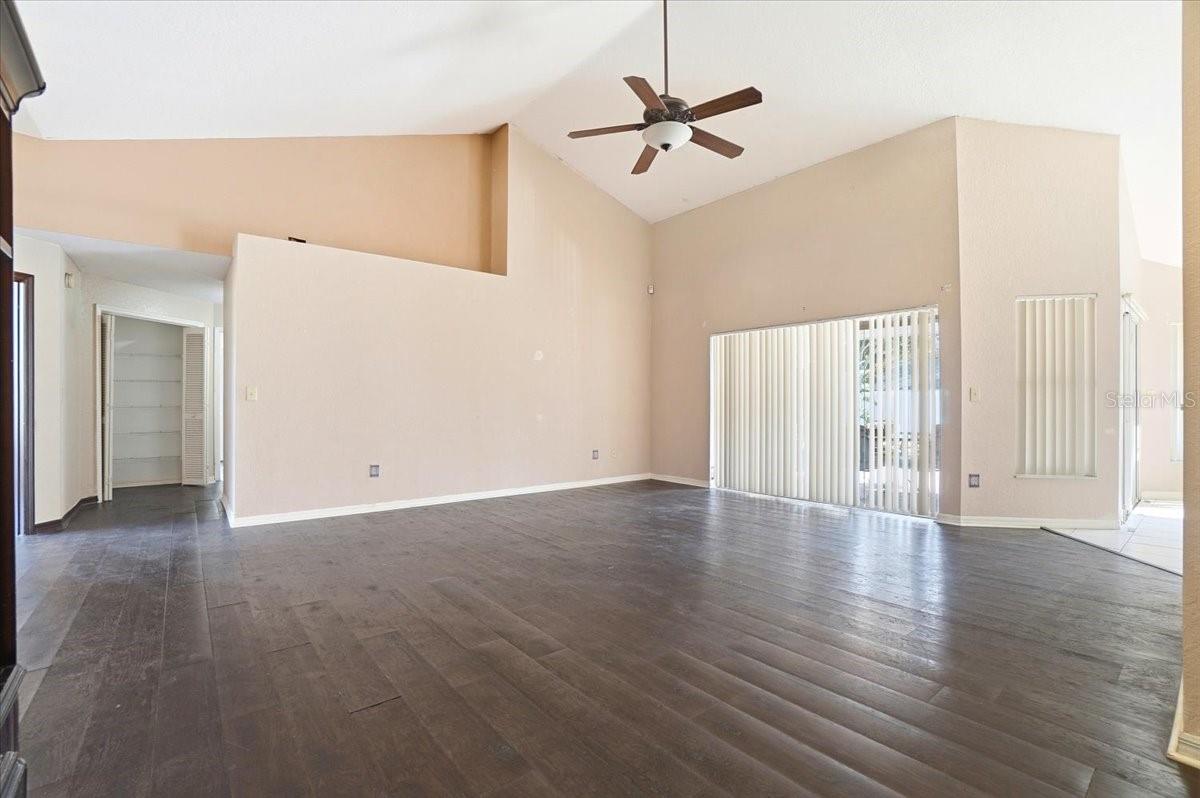 Living room with accordion-style sliding door to pool