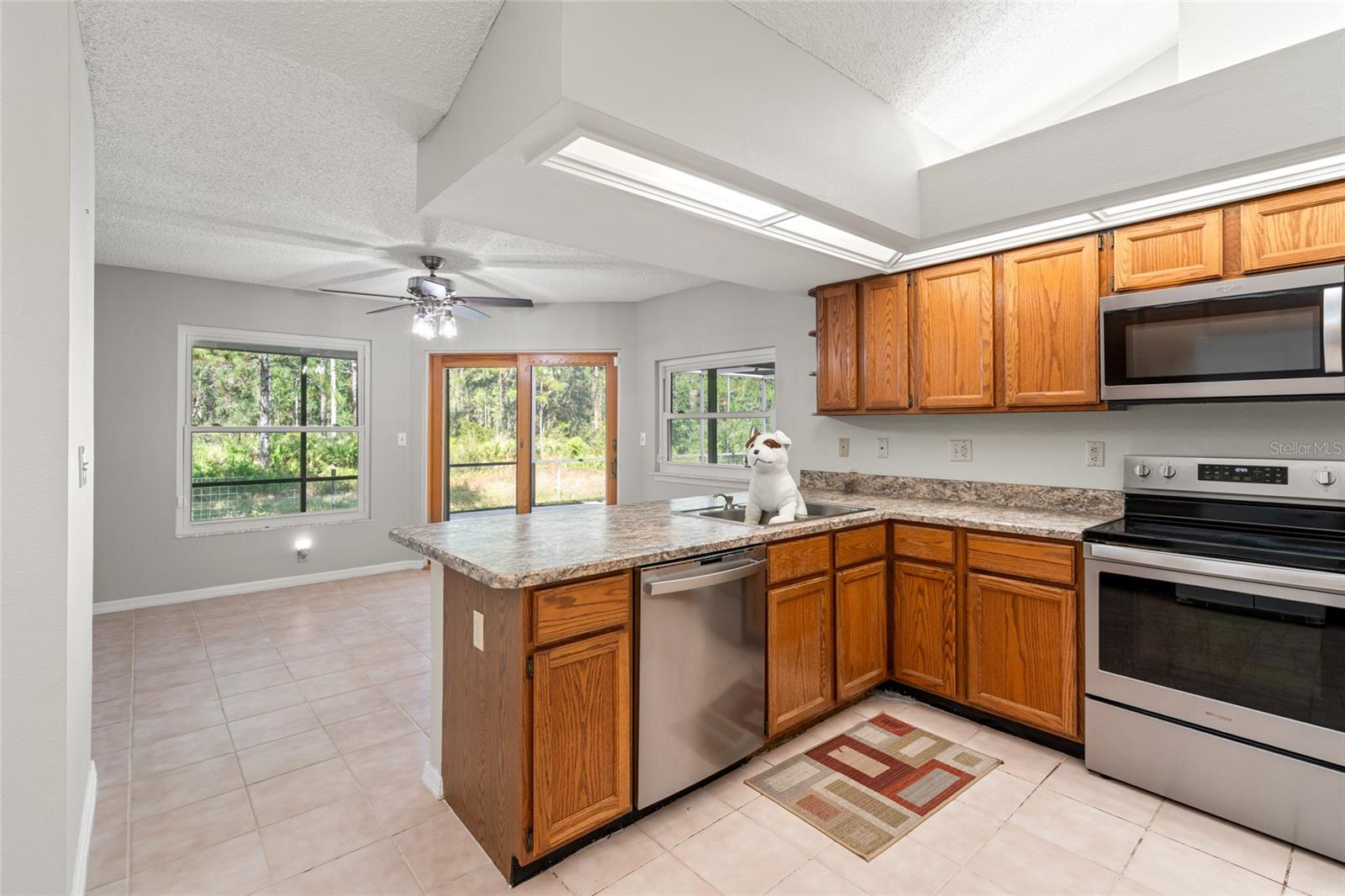 Large Kitchen w/ SS appliances, lots of cabinets and counter space and 2 pantries