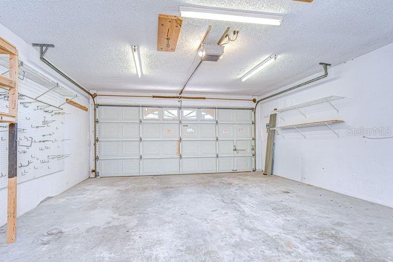 2-Car Garage with extra  storage and shelving