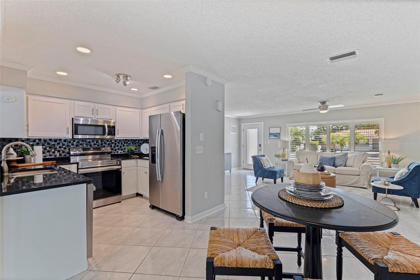 Dining Room/Breakfast nook looking towards kitchen and living room in front of house