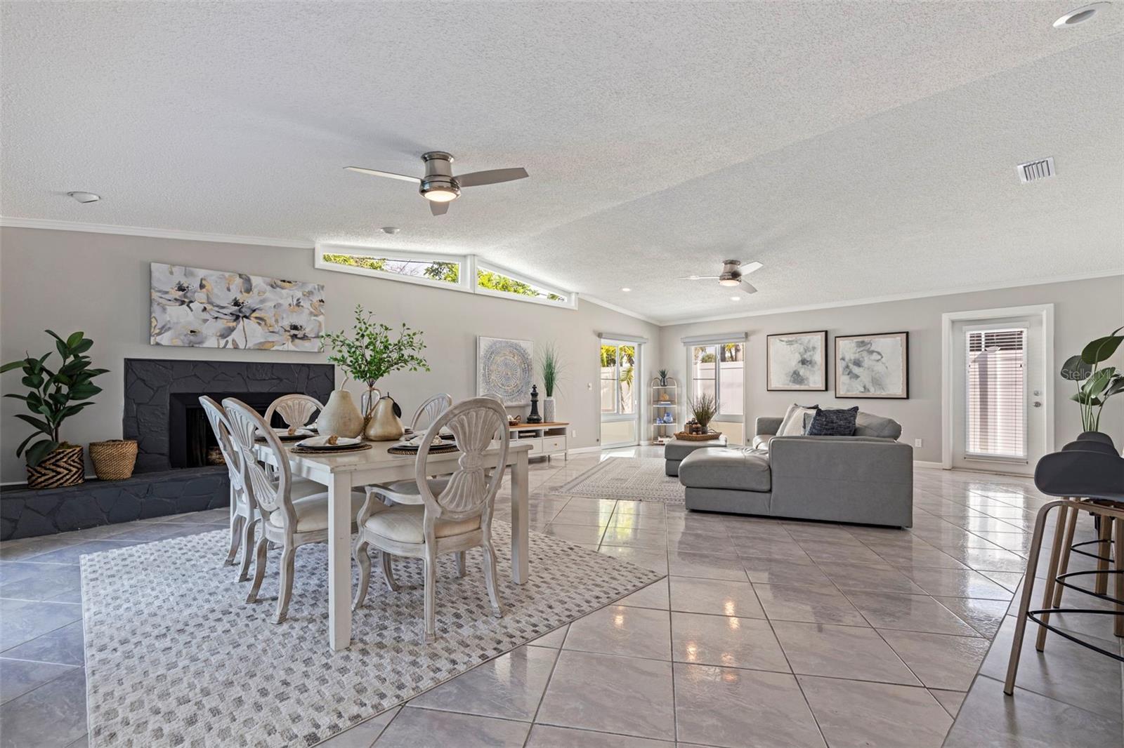 Family Room with fireplace at rear of house off pool area