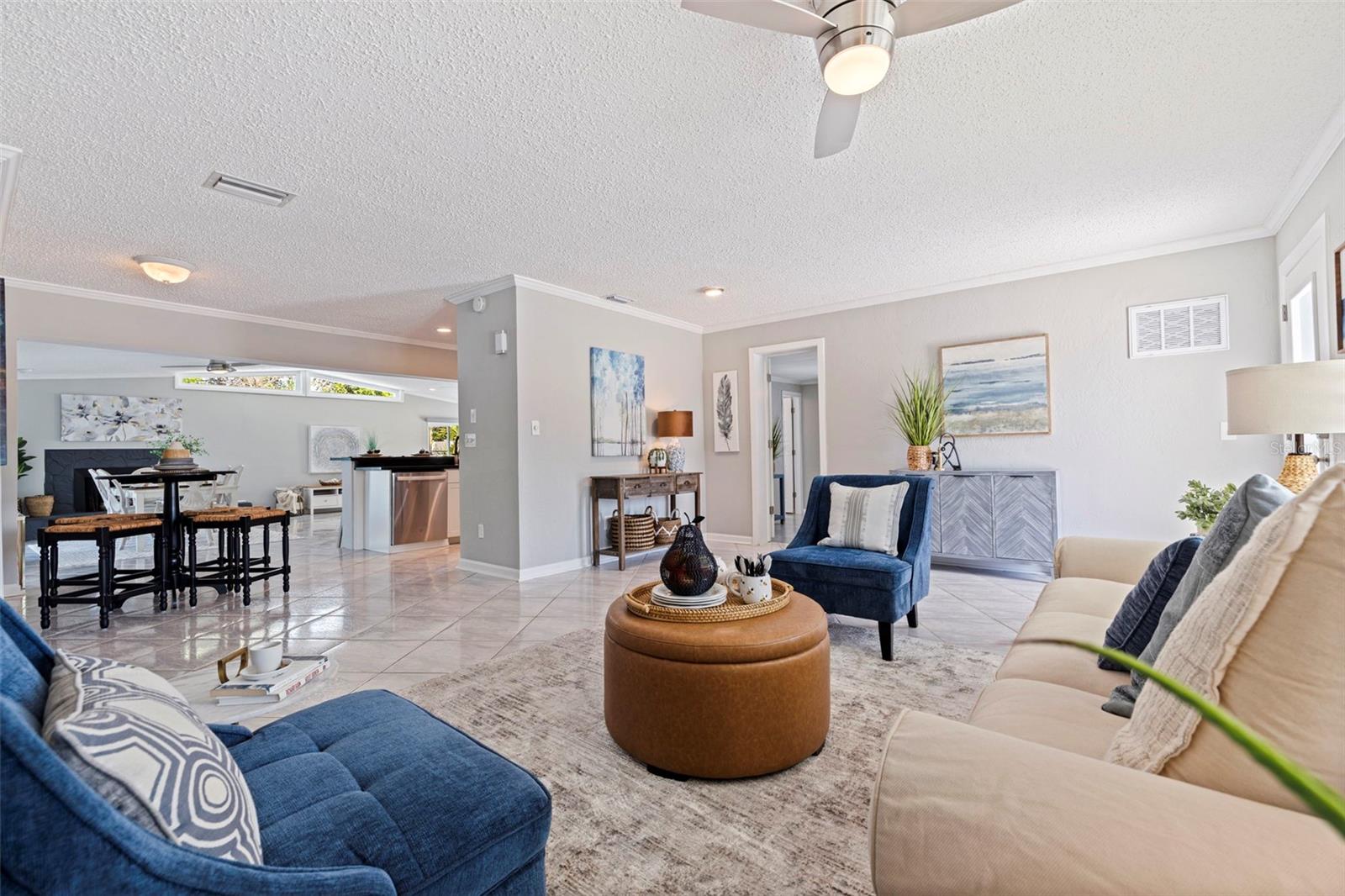 Living room looking towards door to the Primary Bedroom and Dining Room into Family Room