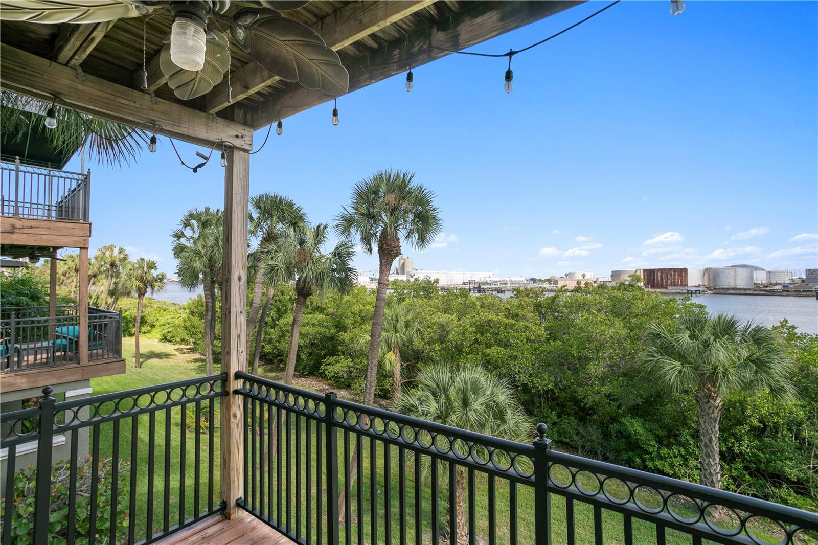 Enjoy dining alfresco on the balcony as boats glide along Sparkman Channel.