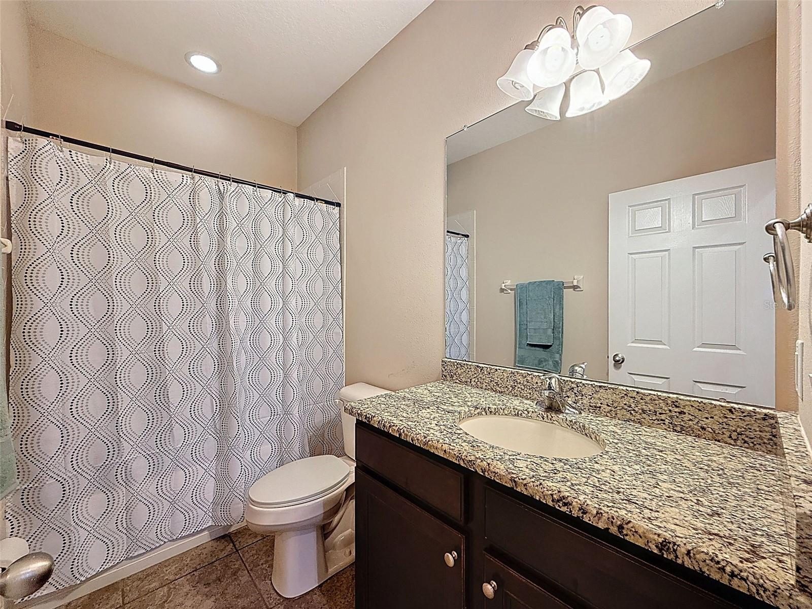 Secondary bath with GRANITE countertop