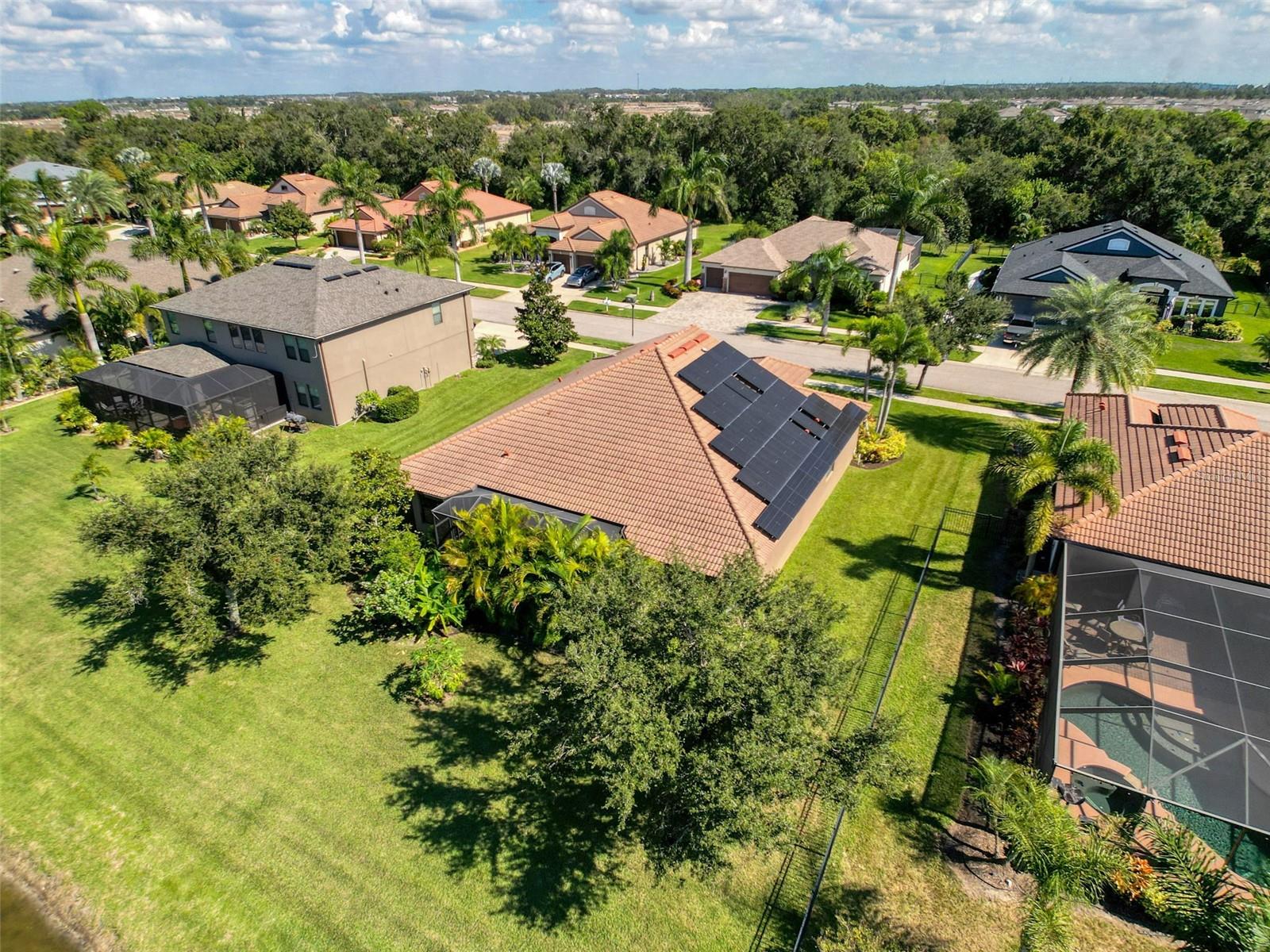 The landscaping provides quite a bit of shade and privacy and the $80k solar panel system also offers the large battery generate system