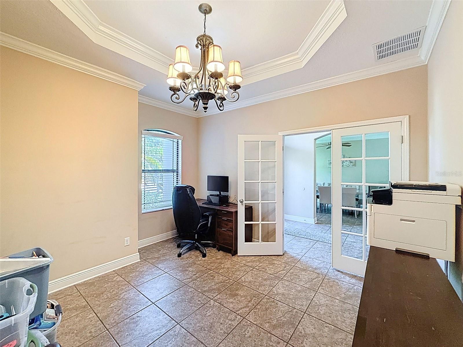 Front flex room offers privacy, french doors, crown molding and gorgeous tray ceiling with more crown accents!