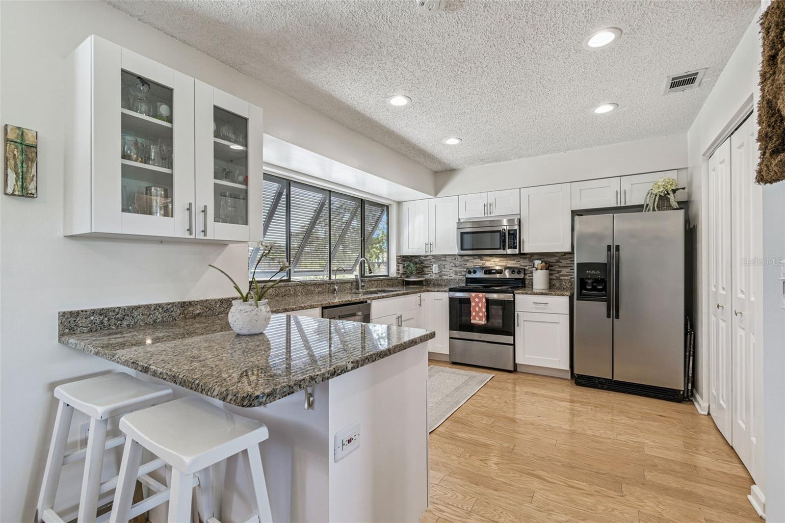 Updated cabinets, granite countertops, stainless steel applicances and a large pantry for all your storage needs.