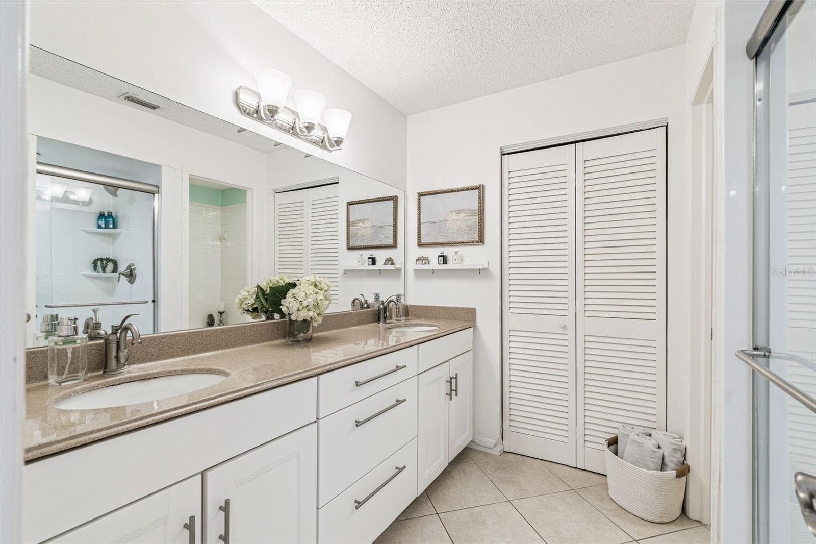 Primary Bath with double vanities and linen closet...
